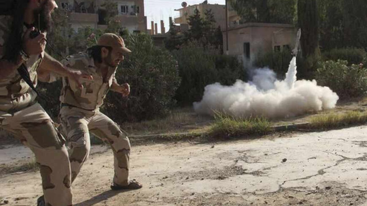 Members of the Free Syrian Army react as they fire a home-made rocket towards forces loyal to the Syrian regime in Deir al-Zor Members of the Free Syrian Army react as they fire a home-made rocket towards forces loyal to the Syrian regime in Deir al-Zor, June 16, 2013. Picture taken June 16, 2013. REUTERS/Khalil Ashawi (SYRIA - Tags: CONFLICT) - RTX10QLQ