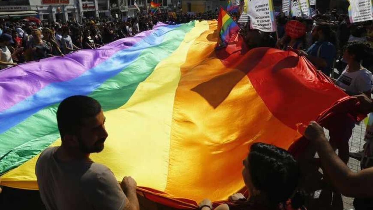 Gay rights activists carry rainbow flag during a protest at Taksim Square in Istanbul Gay rights activists carry a rainbow flag during a protest at Taksim Square in Istanbul June 23, 2013. REUTERS/Marko Djurica (TURKEY - Tags: CIVIL UNREST SOCIETY) - RTX10Y6Y