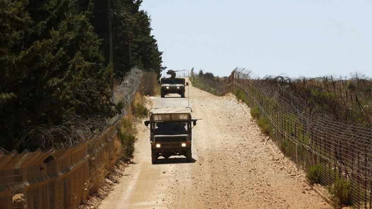 Israeli army vehicles patrol along Israel's border with Lebanon near Avivim Israeli army vehicles patrol along Israel's border with Lebanon near the northern village of Avivim July 3, 2013. Israel is bolstering its forces on the once-quiet frontier with Syria where it believes Lebanese Hezbollah militants are preparing for the day when they could fight Israel. Picture taken July 3, 2013. REUTERS/Baz Ratner (ISRAEL - Tags: MILITARY POLITICS) - RTX11IMG