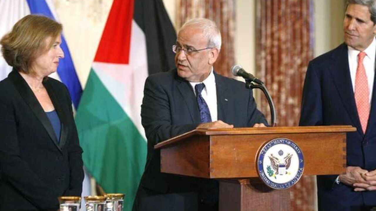Chief Palestinian negotiator Saeb Erekat directs remarks to Israel's Justice Minister Tzipi Livni during a news conference with U.S. Secretary of State John Kerry in Washington Chief Palestinian negotiator Saeb Erekat (C) directs remarks to Israel's Justice Minister Tzipi Livni (L) during a news conference with U.S. Secretary of State John Kerry (R) at the end of talks at the State Department in Washington July 30, 2013. Israeli and Palestinian negotiators held their first peace talks in nearly three years on Monday in a U.S.-brokered effort that Kerry hopes will end their conflict despite deep divisions. REUTERS/Jonathan Ernst (UNITED STATES - Tags: POLITICS) - RTX124ZT