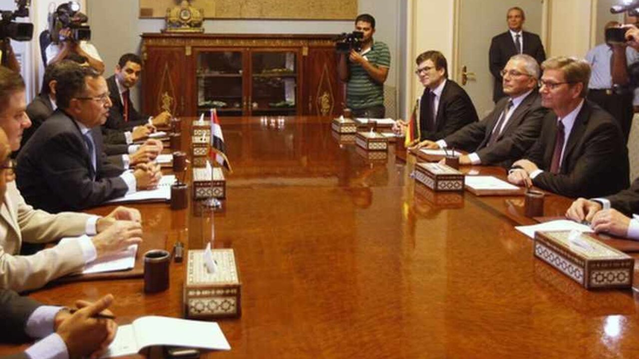 Egypt's interim Foreign Minister Nabil Fahmy speaks as German Foreign Minister Guido Westerwelle looks on during their meeting in Cairo Egypt's interim Foreign Minister Nabil Fahmy (3rd L) speaks as German Foreign Minister Guido Westerwelle (2nd R) looks on during their meeting in Cairo August 1, 2013. Germany urged Egypt to avoid "the appearance of selective justice" on Thursday amid a crackdown on deposed President Mohamed Mursi's Muslim Brotherhood, which remained defiantly dug in at a protest camp the police have orders to remove. REUTERS/Mohamed Abd El Ghany (EGYPT - Tags: POLITICS CIVIL UNREST) - RTX126WM