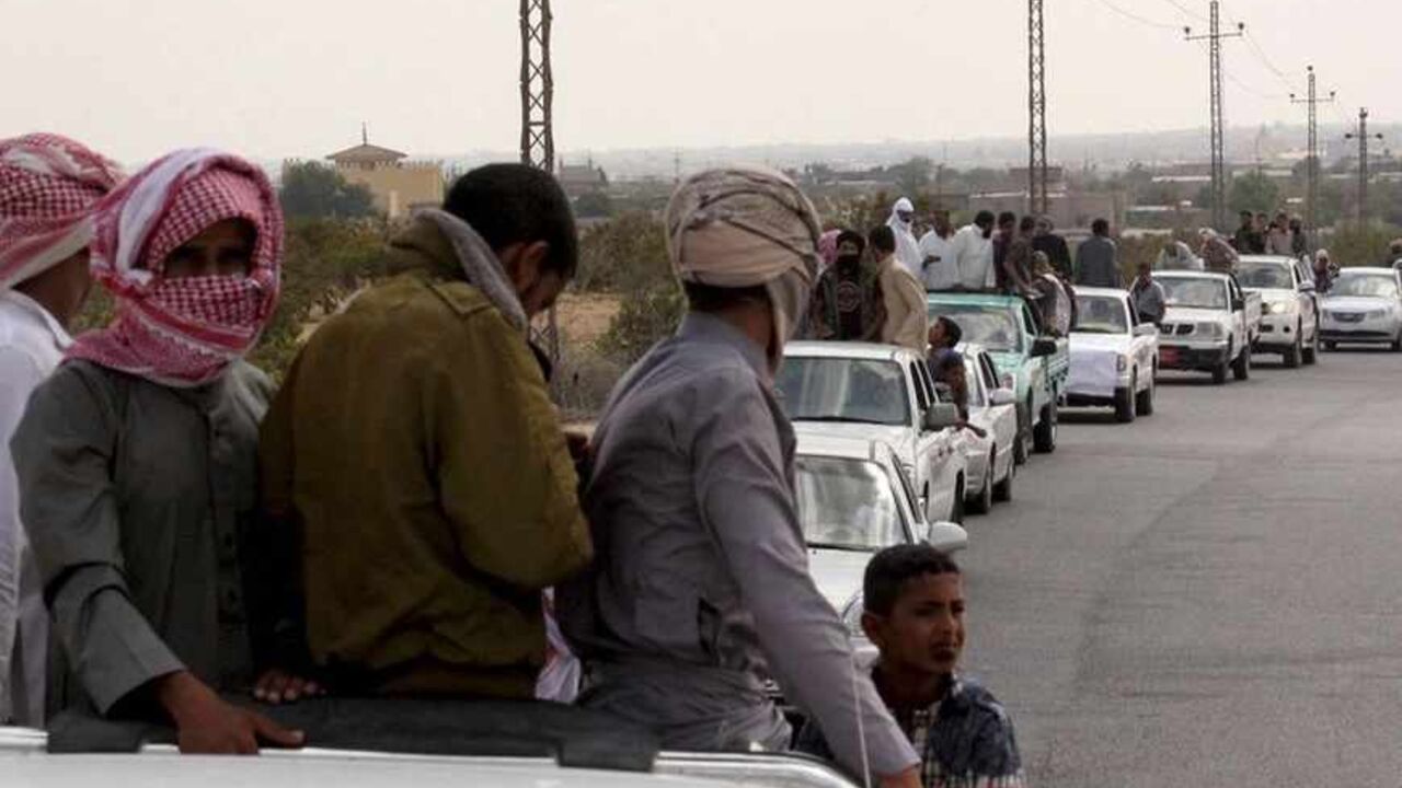 A funeral convoy carrying the bodies of four Islamist militants drives through Sheikh Zuweid, in the north of the Sinai peninsula A funeral convoy carrying the bodies of four Islamist militants drives through Sheikh Zuweid, in the north of the Sinai peninsula, August 10, 2013. The four Islamist militants were killed by an air strike that their comrades said had been done by an Israeli drone but which state media said was the work of an Egyptian army helicopter. REUTERS/ Stringer (EGYPT - Tags: CIVIL UNREST POLITICS) - RTX12G5D