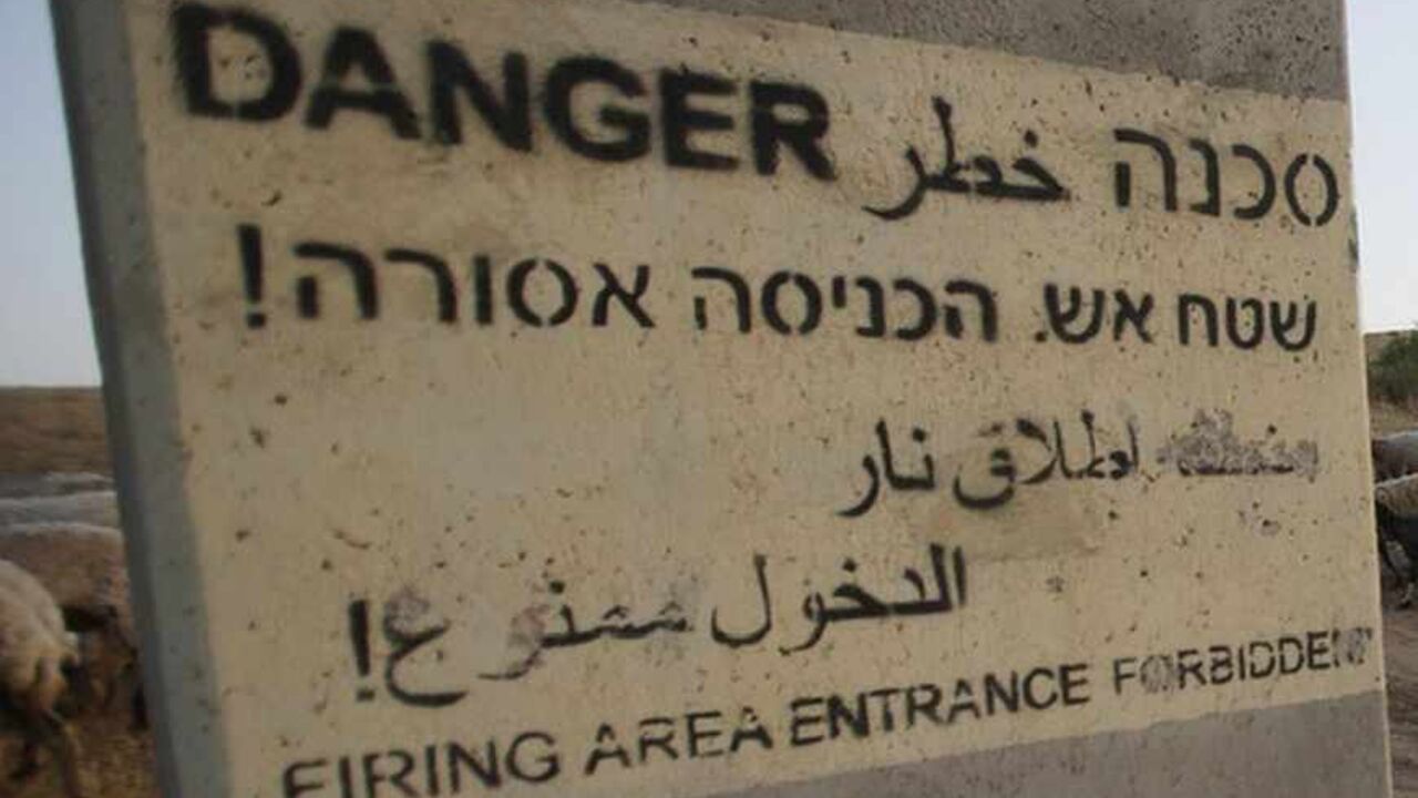 A Bedouin boy rides a donkey near a sign in a West Bank village, near the border with Jordan A Bedouin boy rides a donkey near a sign in the West Bank village of Wadi al-Maleh, near the border with Jordan April 29, 2013. Israeli soldiers on Monday evicted several hundred Bedouins from the village in the occupied West Bank after the army declared the area a live-fire training zone. The residents of Wadi al-Maleh, a village mostly inhabited by shepherds in the arid area, had almost all left their homes by an evening curfew and retreated to neighbouring villages, a local leader told Reuters. REUTERS/M