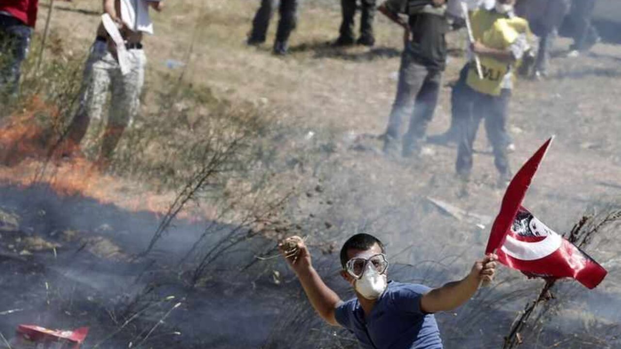 A protester prepares to throw a stone at Turkish riot police during clashes after protesters tried to march to a courthouse in Silivri A protester prepares to throw a stone at Turkish riot police during clashes after protesters tried to march to a courthouse in Silivri, where a hearing on people charged with attempting to overthrow Prime Minister Tayyip Erdogan's Islamist-rooted government is due to take place August 5, 2013. A Turkish court on Monday sentenced a former military commander to life in prison and dozens of others including opposition members of parliament to long terms for plotting against the government, in a case that has e