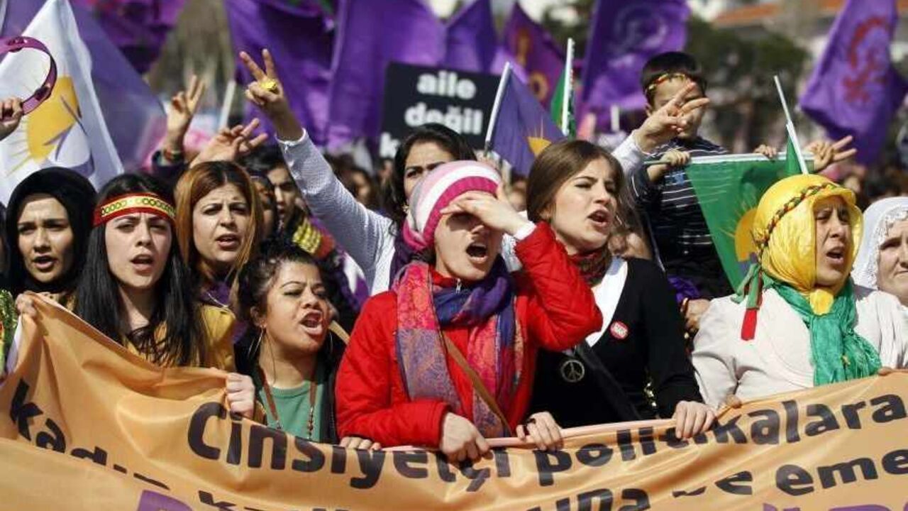 TURKEY/ Women walk as they shout slogans during a rally calling for gender equality, two days after International Women's Day, in Istanbul March 10, 2013. REUTERS/Osman Orsal (TURKEY - Tags: POLITICS CIVIL UNREST) - RTR3ET3V