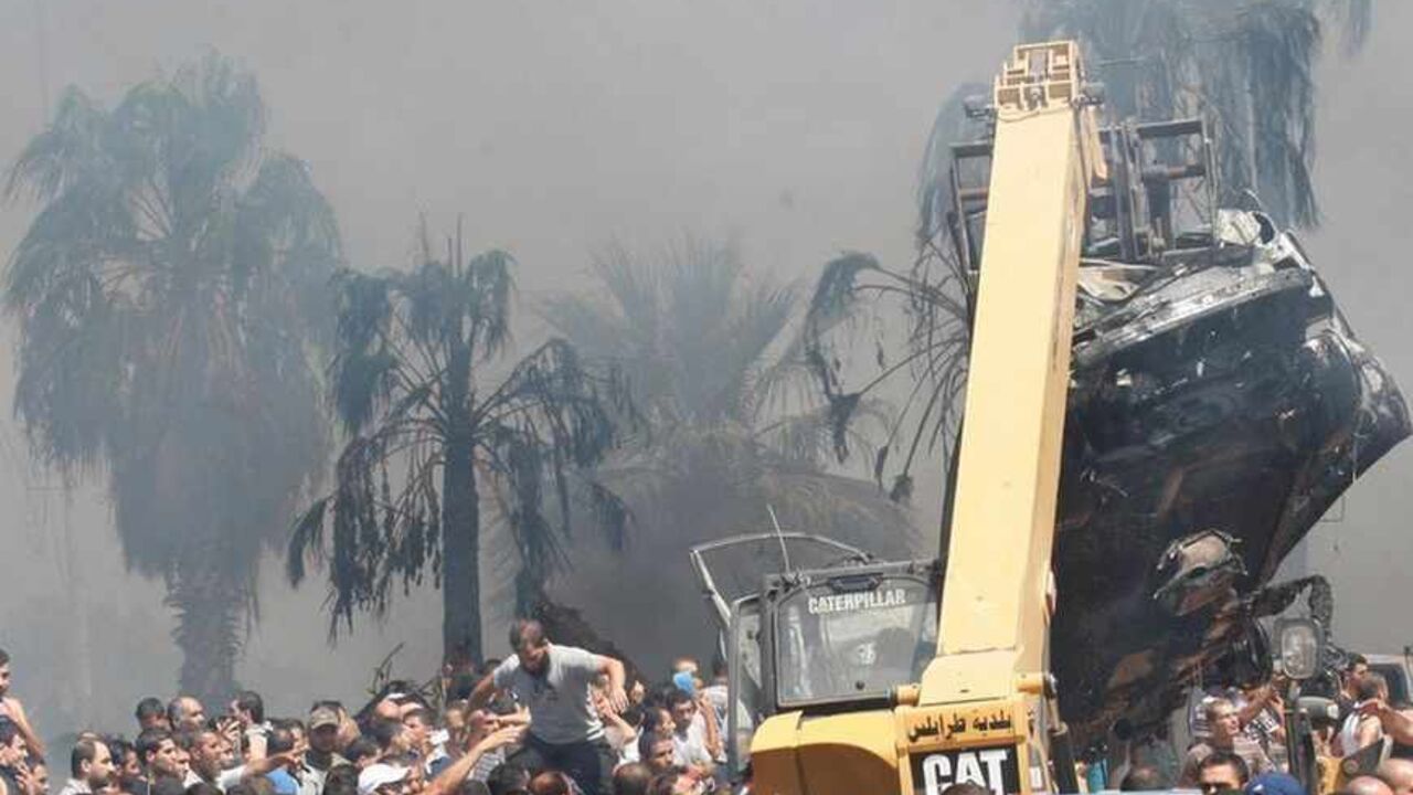 A crane removes burnt cars from outside one of two mosques hit by explosions in Lebanon's northern city of Tripoli A crane removes burnt cars from outside one of two mosques hit by explosions in Lebanon's northern city of Tripoli, August 23, 2013. Twin explosions outside two mosques killed at least 27 people and wounded hundreds in apparently coordinated attacks in the northern Lebanese city of Tripoli on Friday, a senior health official and witnesses said. REUTERS/Sobhi Al-Sharif (LEBANON - Tags: POLITICS CIVIL UNREST) - RTX12U8F