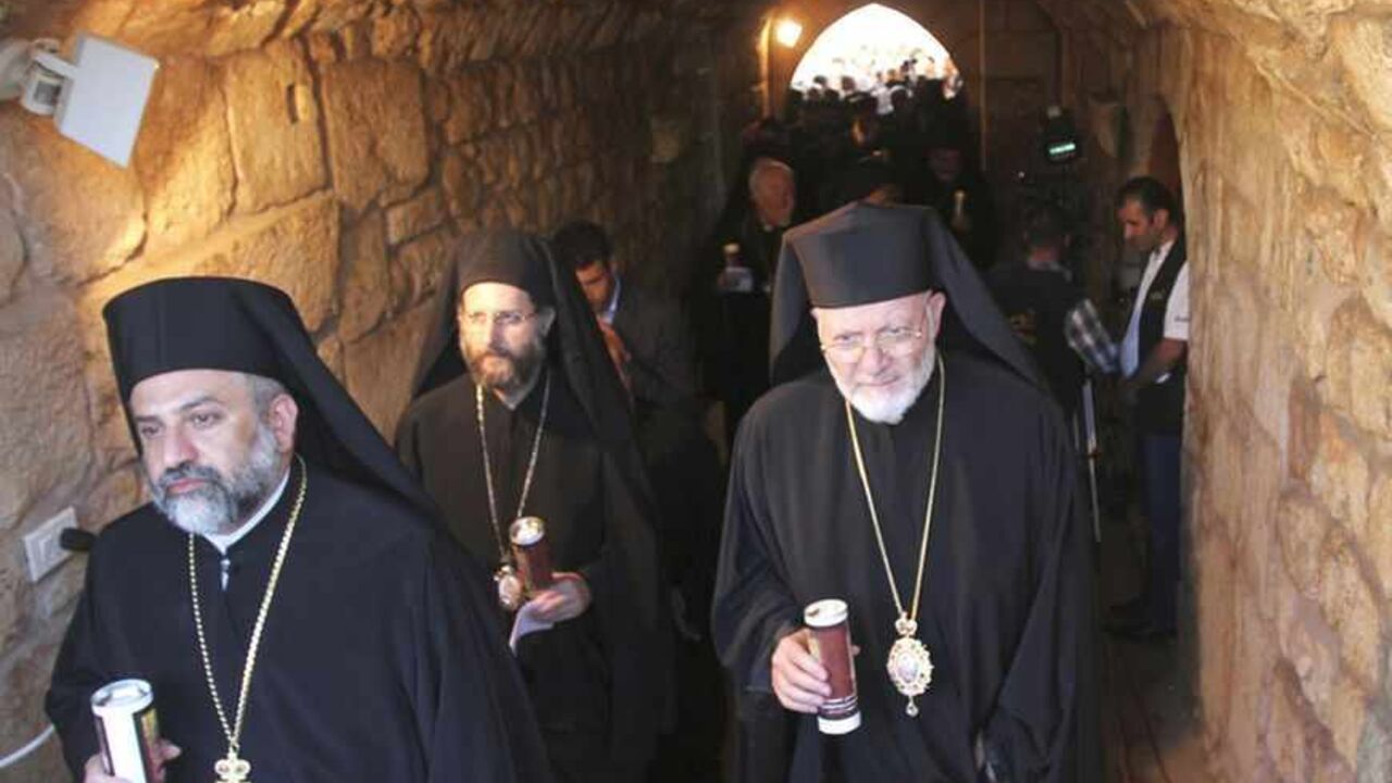 Christian clerics hold candles during a candle-lit vigil at the Balamand Monastery in Koura, near the north Lebanese city of Tripoli, to call for the release of bishops kidnapped in northern Syria two months ago, June 22, 2013. Greek Orthodox Patriarch John Yazigi led the candle-lit vigil on Saturday for Greek Orthodox archbishop Paul Yazigi and Syriac Orthodox archbishop Yohanna Ibrahim, appealing to their kidnappers to free them and urging Syrian security forces to do more to win their release. REUTERS/Om