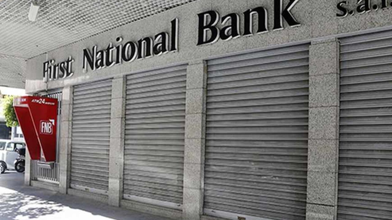 LEBANON/ A closed First National Bank branch is seen in Beirut September 4, 2013. Banks and private business corporations saw a one-day strike being held in many parts of Lebanon on Wednesday, organised by economic committees aiming to pressure Lebanese political parties to form a cabinet to maintain the country's economy, local media reported. REUTERS/Mohamed Azakir (LEBANON - Tags: BUSINESS CIVIL UNREST POLITICS) - RTX136O5