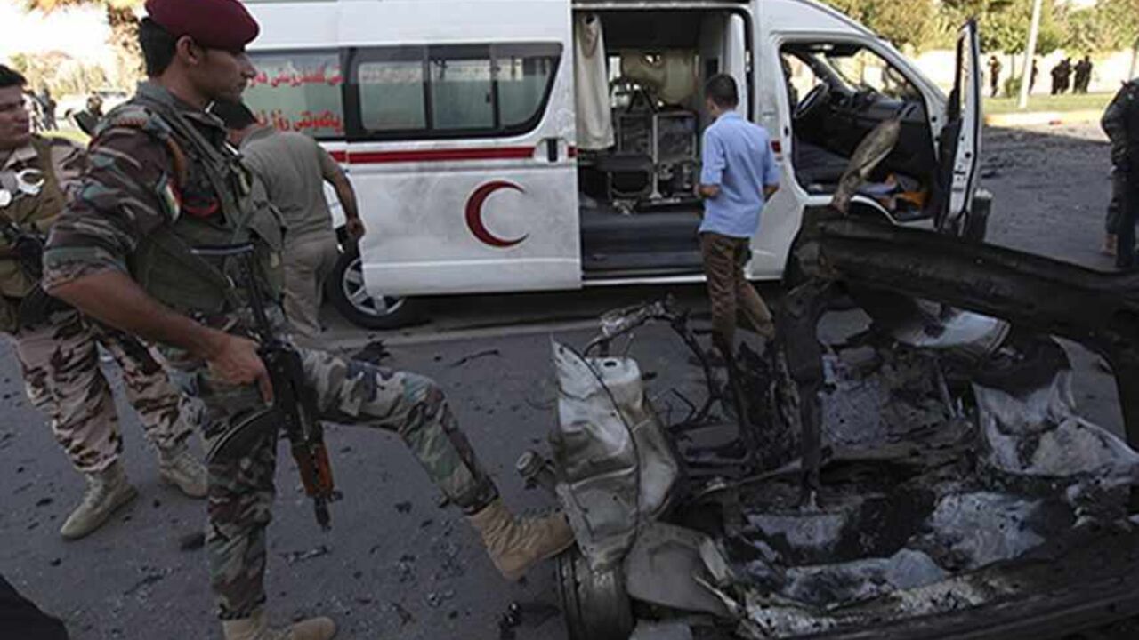 IRAQ-KURDS/EXPLOSION Kurdish security forces inspect the site of a bomb attack in the city of Arbil, the capital of the autonomous Kurdistan region, about 350 km (217 miles) north of Baghdad, September 29, 2013. Six people were killed on Sunday in a series of explosions outside a security directorate in the capital of Iraq's usually peaceful autonomous Kurdistan region, security and medical sources said. Gunfire could be heard after the blasts in Arbil that wounded a further 36 people, according to the city's health directorate