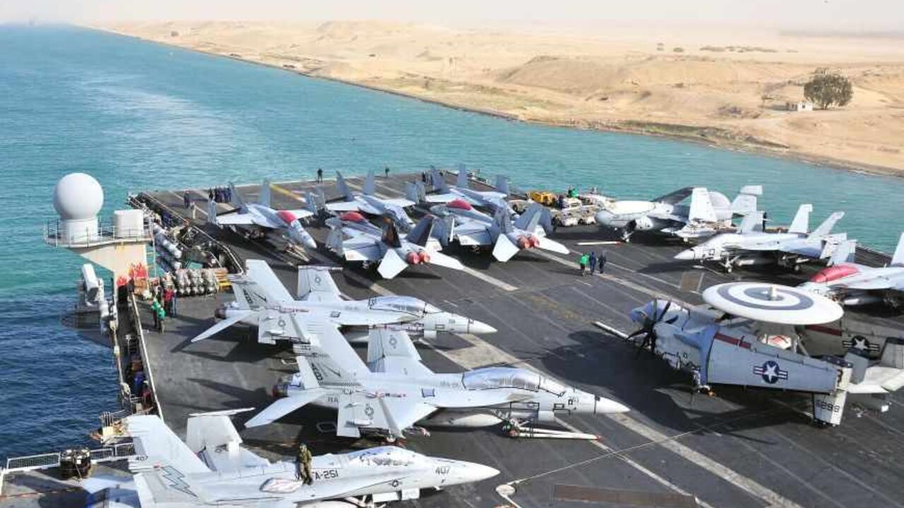 LIBYA-USA/ The aircraft carrier USS Enterprise transits the Suez Canal in Egypt in this February 15, 2011 handout photo provided by the U.S. Navy. The United States is moving warships and aircraft, including the USS Enterprise, into the Mediterranean Sea near Libya, according to U.S. officials. REUTERS/U.S. Navy/Mass Communication Specialist Seaman Jesse L. Gonzalez/Handout (EGYPT - Tags: MILITARY POLITICS) FOR EDITORIAL USE ONLY. NOT FOR SALE FOR MARKETING OR ADVERTISING CAMPAIGNS. THIS IMAGE HAS BEEN SUPPLIED BY A T