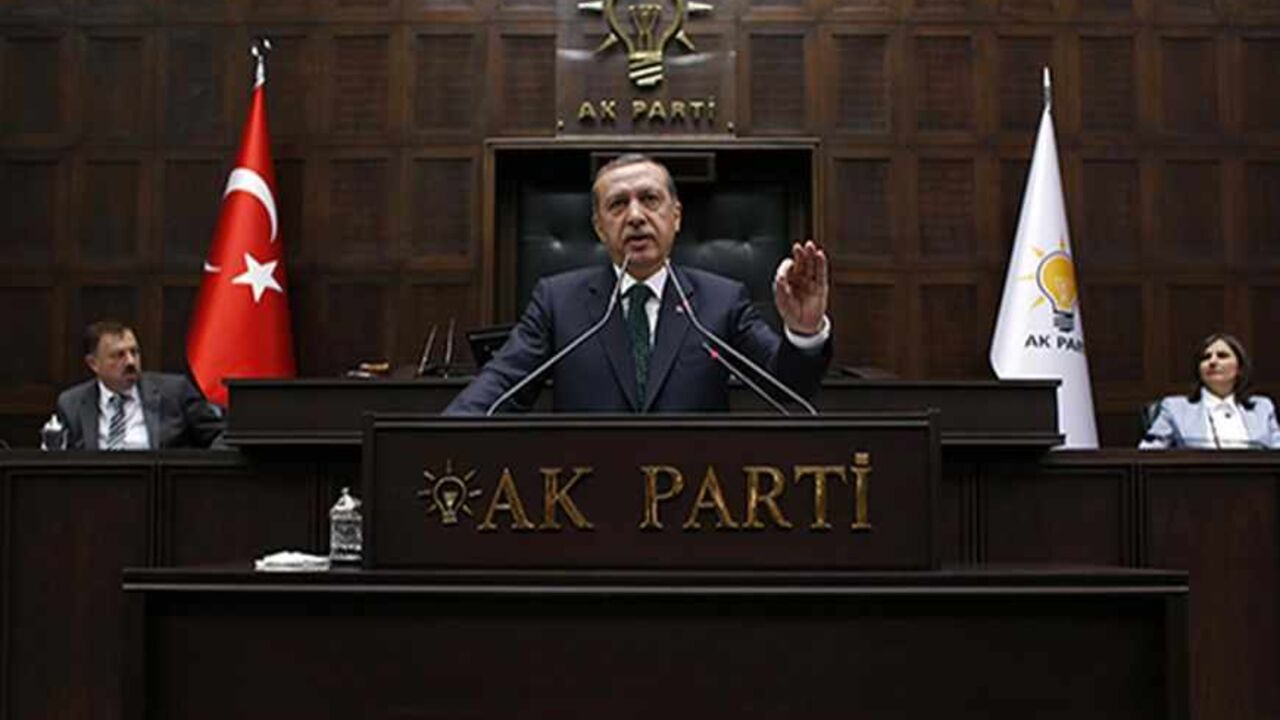 TURKEY-PROTESTS/ERDOGAN Turkey's Prime Minister Tayyip Erdogan addresses members of parliament from his ruling AK Party (AKP) during a meeting at the Turkish parliament in Ankara June 11, 2013. Erdogan called on protesters to withdraw from central Istanbul's Gezi Park on Tuesday and said the anti-government demonstrations were part of a deliberate attempt to damage Turkey's image and economy. REUTERS/Umit Bektas (TURKEY - Tags: POLITICS CIVIL UNREST) - RTX10JI0