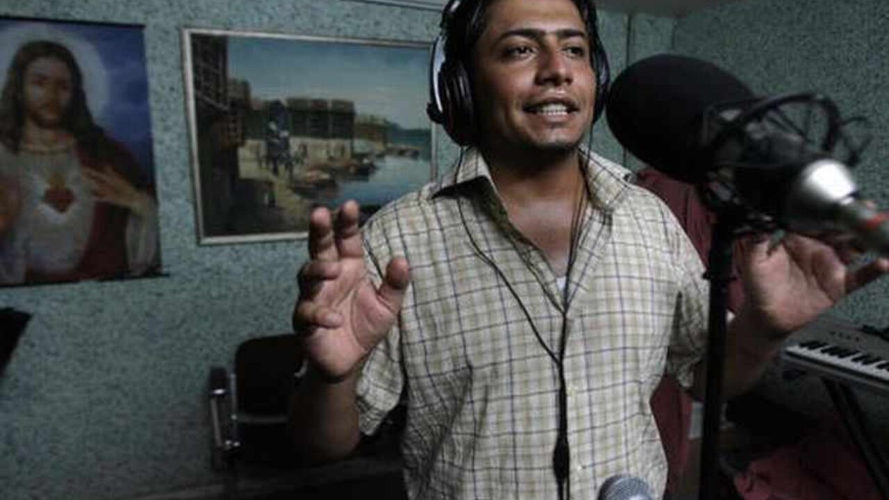 Nic183431 Baghdad, IRAQ: TO GO WITH AFP ARABIC STORY BY AHMAD AL-RUBAYE
Young Iraqi singer Hassan Hadi registers the songs of his new album at a studio in Baghdad, 14 July 2007. Unlike neighboring countries, singing became rare in Iraq due to the violence tearing apart the war plagued country. AFP PHOTO/AHMAD AL-RUBAYE (Photo credit should read AHMAD AL-RUBAYE/AFP/Getty Images)