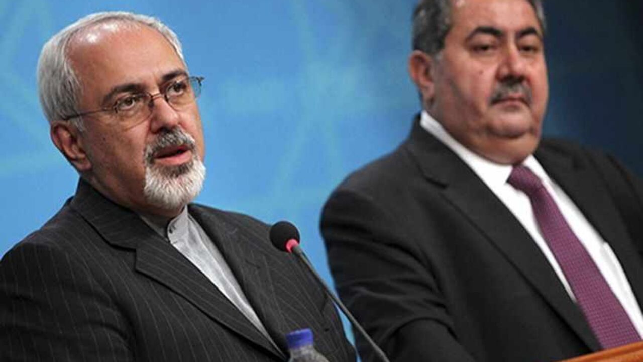 IRAQ-IRAN/VISIT Iranian Foreign Minister Mohammad Javed Zarif (L) speaks during a joint news conference with his Iraqi counterpart Hoshyar Zebari in Baghdad, September 8, 2013. The United States will ignite a fire across the Middle East if it attacks Syria, Zarif said on a visit to Iraq on Sunday, warning Western powers against warmongering. REUTERS/Ahmad Al-Rubaye/Pool (IRAQ - Tags: POLITICS) - RTX13CUF