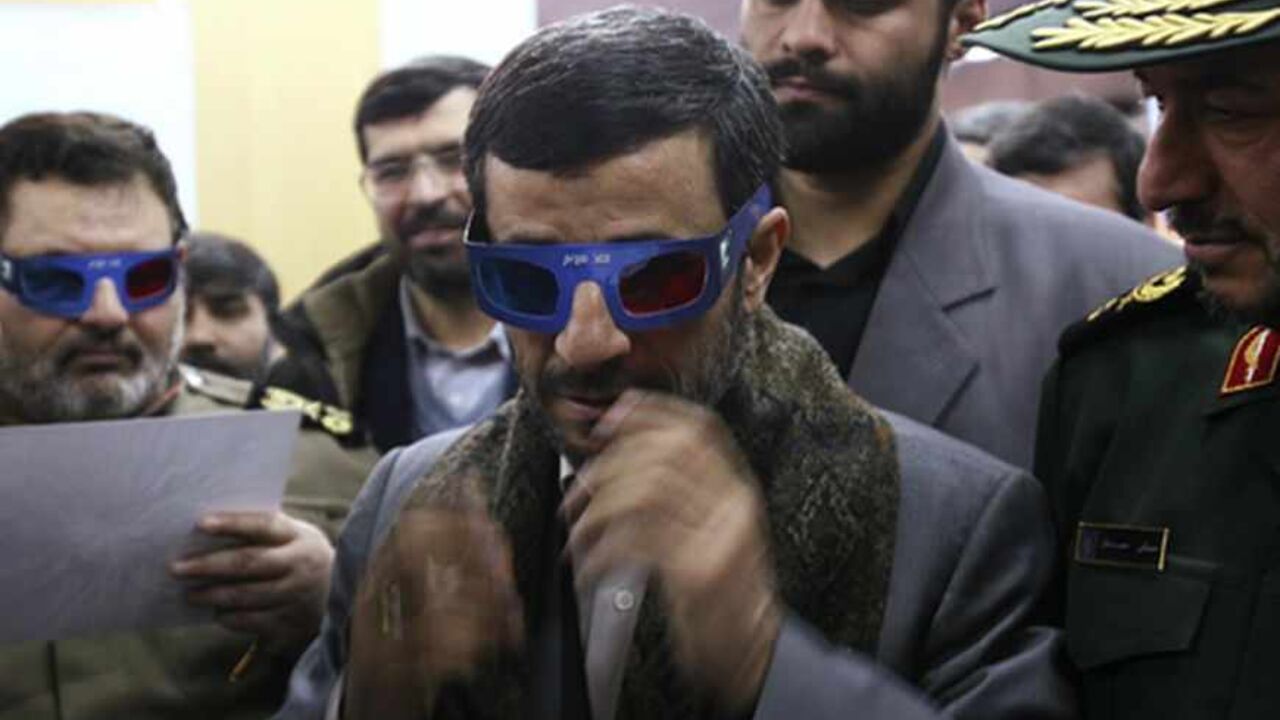 IRAN-ROCKET/ Iranian President Mahmoud Ahmadinejad wears 3-D glasses to watch a programme about an Iranian rocket during a visit to the control centre for Iran's space programme near Tehran February 4, 2008. Iran launched a rocket on Monday designed to send its first homemade research satellite into orbit in the next year, state television said, a move likely to add to Western concerns about Tehran's nuclear plans. REUTERS/Fars News (IRAN) also see GF2DXFSYXNAA - RTR1WNQL