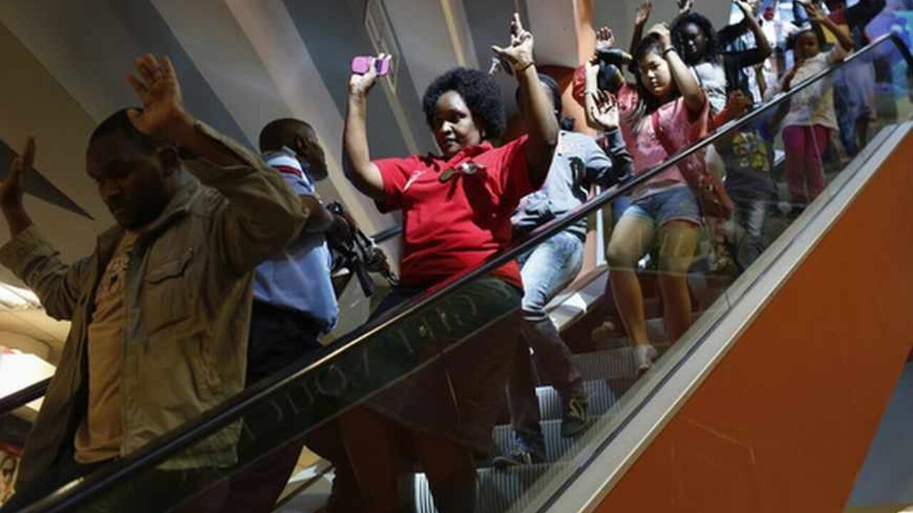Civilians escape an area at the Westgate Shopping Centre in Nairobi Civilians escape an area at the Westgate Shopping Centre in Nairobi September 21, 2013. Gunmen stormed the shopping mall in Nairobi on Saturday killing at least 20 people in what Kenya's government said could be a terrorist attack, and sending scores fleeing into shops, a cinema and onto the streets in search of safety. Sporadic gun shots could be heard hours after the assault started as soldiers surrounded the mall and police and soldiers combed the building, hunting down the attackers shop by shop. REUTE