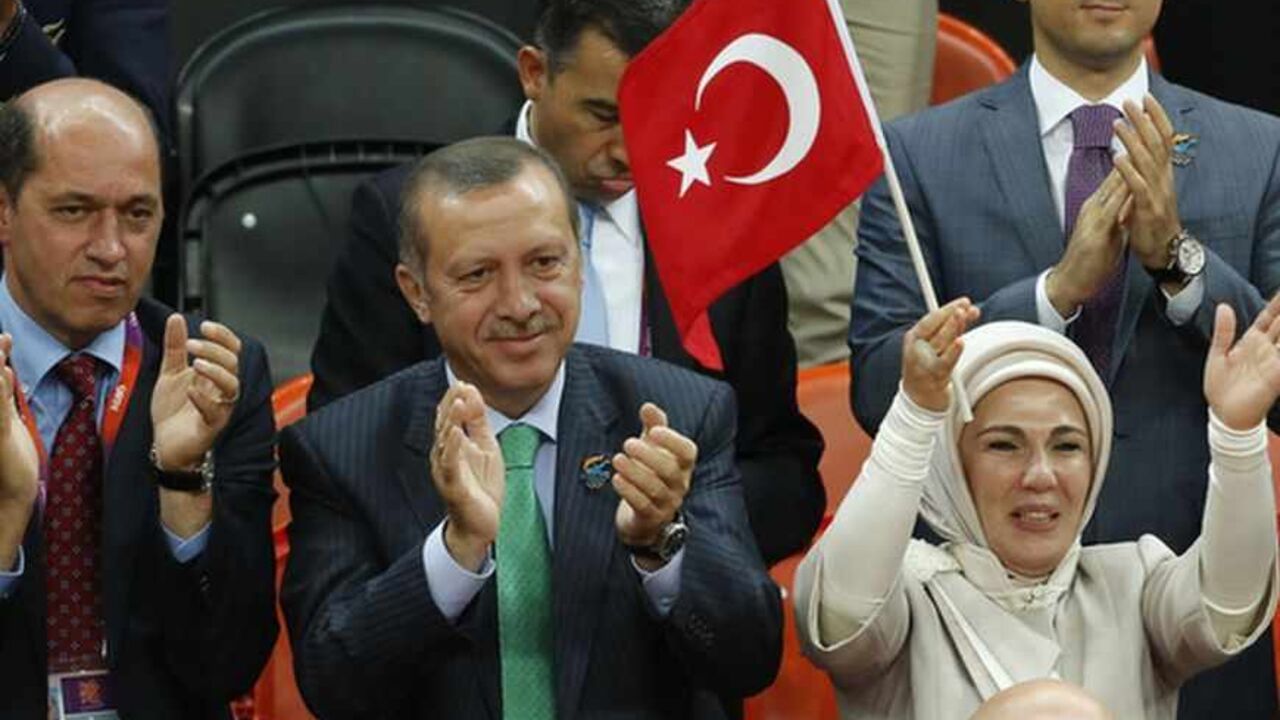 Turkey's Prime Minister Recep Tayyip Erdogan (2nd L) and his wife Emine Erdogan attend the women's qualification game Olympic basketball match between Turkey and Angola during the London 2012 Olympic Games Turkey's Prime Minister Recep Tayyip Erdogan (2nd L) and his wife Emine Erdogan attend the women's qualification game Olympic basketball match between Turkey and Angola during the London 2012 Olympic Games July 28, 2012. REUTERS/Luke MacGregor (BRITAIN - Tags: POLITICS SPORT OLYMPICS BASKETBALL) - RTR35I0J