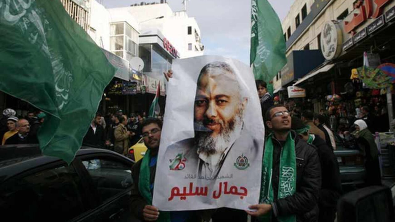 Palestinians hold a placard depicting senior Hamas leader Haniyeh during a rally in Nablus Palestinians hold a placard depicting senior Hamas leader Ismail Haniyeh during a rally in the West Bank city of Nablus, marking the 25th anniversary of the founding of Hamas December 13, 2012. It was the first rally Western-backed Palestinian President Mahmoud Abbas allowed to take place in the West Bank since 2007, when his Islamist rivals Hamas seized control of the Gaza Strip. REUTERS/Muammar Awad (WEST BANK - Tags: POLITICS ANNIVERSARY) - RTR3BJHE