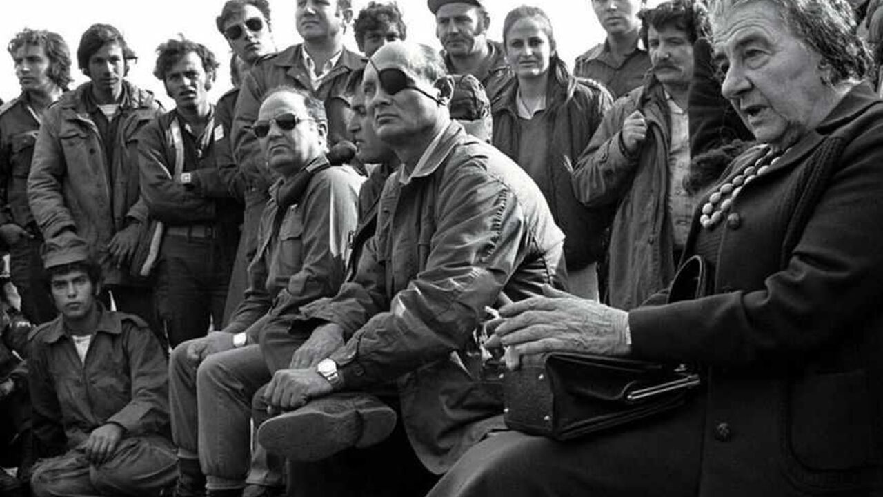 FILER OF GOLDA MEIR VISITING TROOPS ON GOLAN HEIGHTS IN 1973. FILE PHOTO 21NOV97 - FOR RELEASE WITH BC-ISRAEL-ANNIVERSARY-CHRONOLOGY - Prime Minister Golda Meir (R) accompanied by her Defense Minister Moshe Dayan, meets with Israeli soldiers at a base on the Golan Heights after intense fighting during the 1973 Yom Kippur War. Israel was simultaneously attacked by Syria and Egypt on Yom Kippur, the Jewish Day of Atonement when all of Israel comes to a standstill, and was only able to defeat both countries when the United States provided an emergency major resupply of e