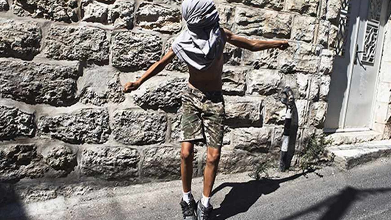 PALESTINIANS-ISRAEL/ A Palestinian boy uses a sling to throw a stone during clashes with Israeli police following Friday prayers in the East Jerusalem neighbourhood of Ras Al Amoud September 27, 2013. An Israeli police spokesman said on Friday that 10 Palestinians were detained on suspicion of throwing stones at policemen who were deployed in the Old City and in nearby Palestinian neighbourhoods of Jerusalem, amid recent tensions over Israel's admittance of Jewish visitors to a holy site in the Old City, which houses the al-Asq