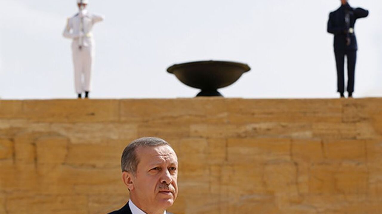 TURKEY/ Turkey's Prime Minister Tayyip Erdogan leaves after a wreath-laying ceremony at the mausoleum of Mustafa Kemal Ataturk, founder of modern Turkey, in Ankara August 1, 2013. REUTERS/Umit Bektas (TURKEY - Tags: MILITARY POLITICS) - RTX126OM