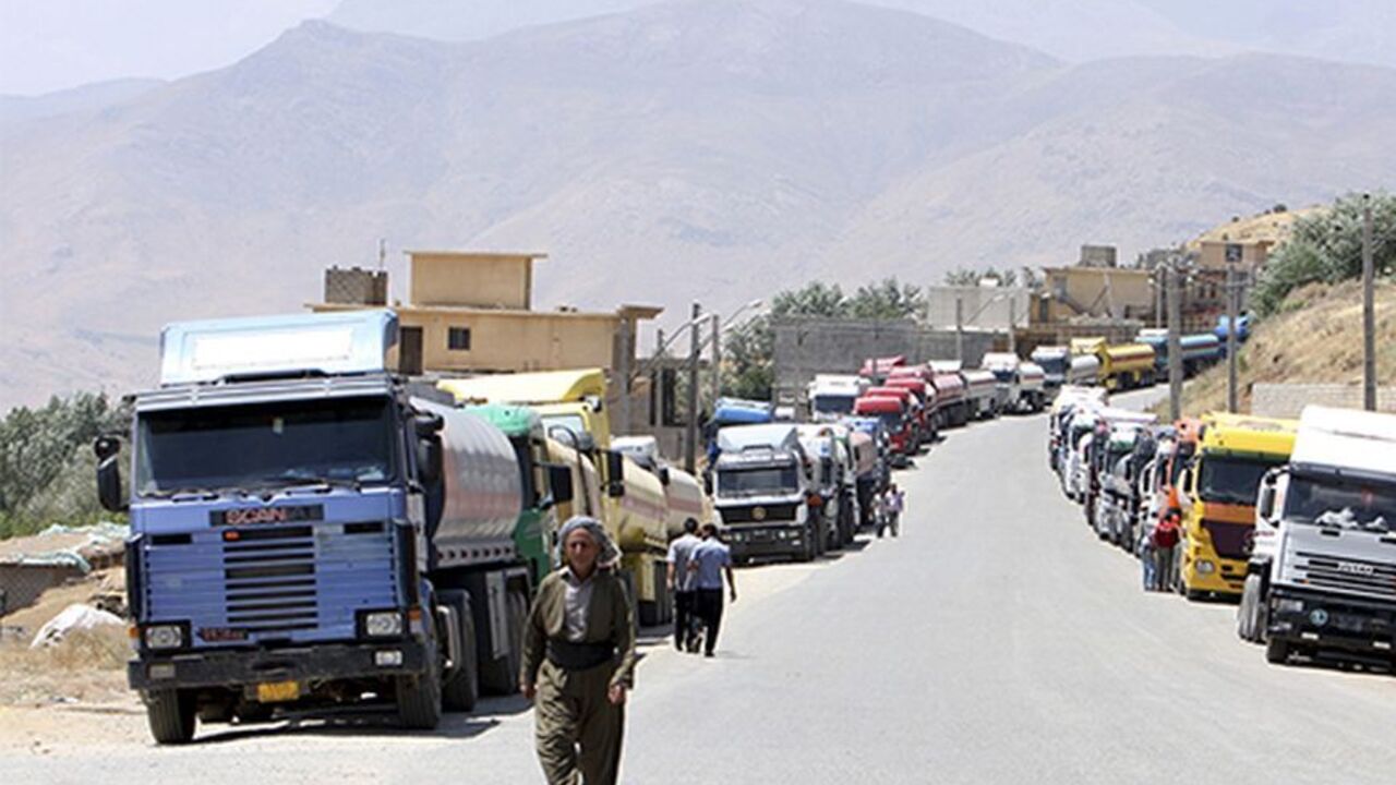 IRAQ-OIL/KURDS Fuel trucks are seen at Haj Umran border crossing with Iran, in northeastern Iraq July 20, 2010. Despite a pledge by Iraqi Kurdistan to crack down on the flow of fuel being smuggled to Iran, the only real impediment truck drivers say they face are long lines that force them to wait for days to cross. Picture taken July 20, 2010. REUTERS/Azad Lashkari (IRAQ - Tags: POLITICS CRIME LAW ENERGY TRANSPORT IMAGES OF THE DAY) - RTR2GMNI