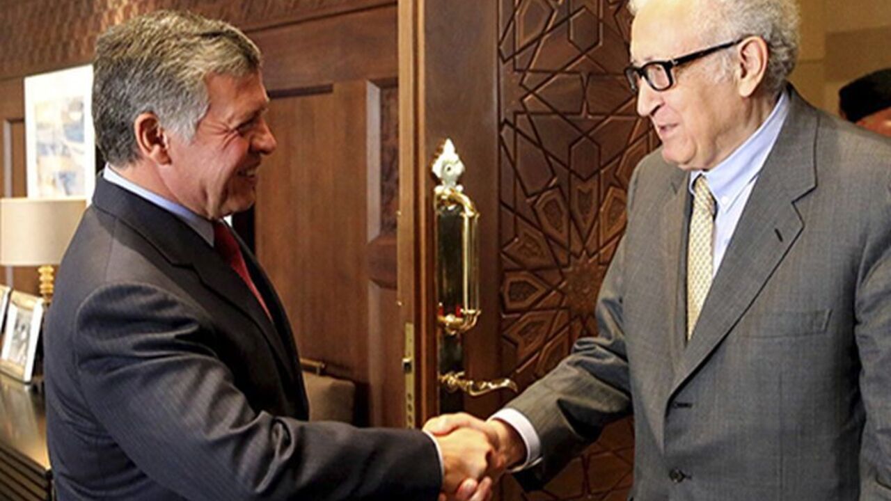 JORDAN/ Jordan's King Abdullah (L) shakes hands with U.N.-Arab League envoy for Syria Lakhdar Brahimi at the Royal Palace in Amman October 23, 2013. REUTERS/Jordanian Royal Palace/Yousef Allan/Handout via Reuters (JORDAN - Tags: POLITICS ROYALS) ATTENTION EDITORS - THIS IMAGE HAS BEEN SUPPLIED BY A THIRD PARTY. IT IS DISTRIBUTED, EXACTLY AS RECEIVED BY REUTERS, AS A SERVICE TO CLIENTS. FOR EDITORIAL USE ONLY. NOT FOR SALE FOR MARKETING OR ADVERTISING CAMPAIGNS - RTX14L3R