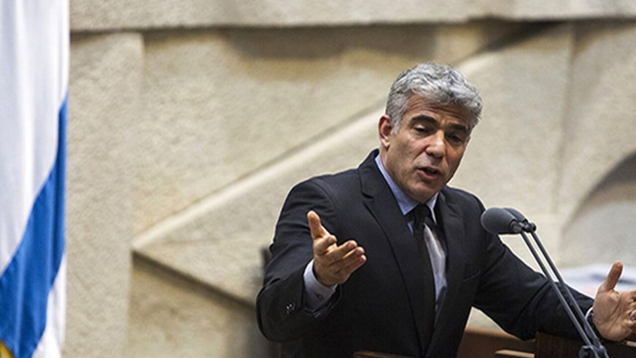 Israel's Finance Minister Yair Lapid gestures as he speaks during the opening of the summer session of the Knesset, the Israeli parliament, in Jerusalem April 22, 2013. Lapid is seeking spending cuts of 18 billion shekels ($5 billion) and tax increases of 5 billion shekels as part of the 2013-2014 budget framework, a spokeswoman for Lapid said on Monday. REUTERS/Baz Ratner (JERUSALEM - Tags: POLITICS BUSINESS) - RTXYVXA