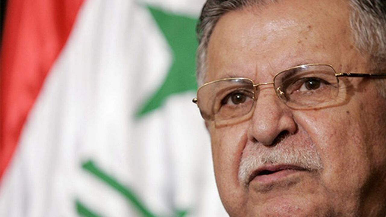 IRAQ Iraqi President Jalal Talabani speaks at a news conference following his meeting with Director of U.S. Foreign Assistance and USAID Administrator Ambassador Randall L. Tobias in the heavily fortified Green Zone in Baghdad May 25, 2006. REUTERS/Ali Haider/Pool - RTR1DQND