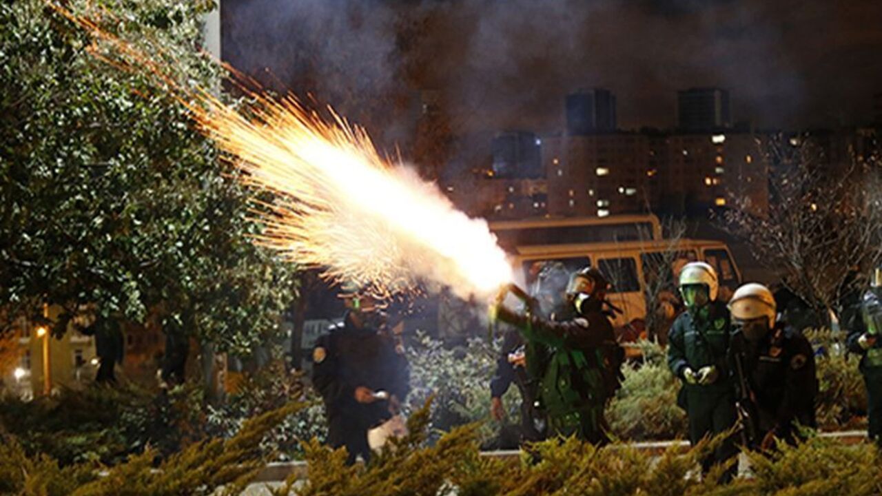 TURKEY/ Police fire tear gas to disperse university students demonstrating against reconstruction plans that include a part of their campus in Ankara early October 19, 2013. The municipality plan, opposed by the students, involves building a road across the Middle East Technical University campus and uprooting a large number of trees in the area. REUTERS/Umit Bektas (TURKEY - Tags: POLITICS CIVIL UNREST EDUCATION ENVIRONMENT TPX IMAGES OF THE DAY BUSINESS CONSTRUCTION) - RTX14GBU