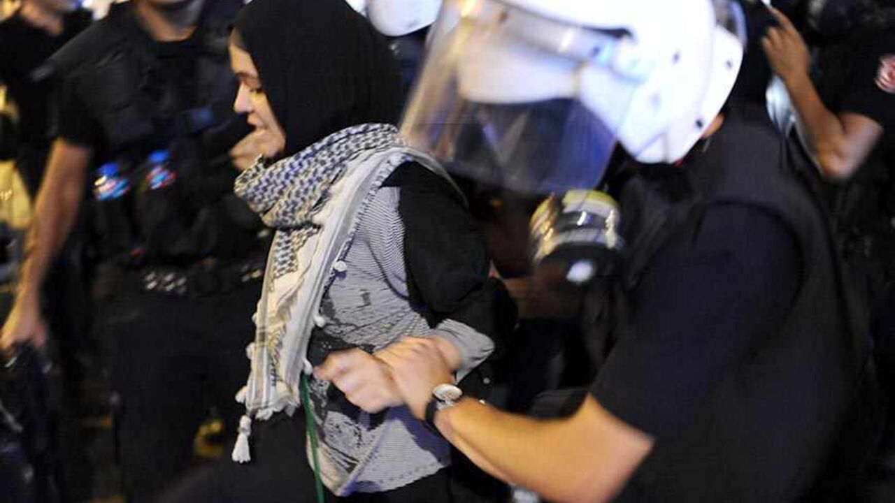 Par7654935 Police arrest a demonstrator on September 10, 2013 during clashes in Istanbul. Turkish police fired tear gas and plastic bullets at thousands of people who gathered in Istanbul on September 10 to protest the September 9 death of a 22-year-old demonstrator in the southeastern city of Antakya. AFP PHOTO/BULENT KILIC (Photo credit should read BULENT KILIC/AFP/Getty Images)