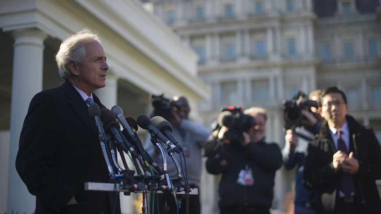 Was8091432 US Senator Bob Corker, R-Tennessee, talks with reporters at the White House after a meeting on Iran with President Obama in Washington, DC, November 19, 2013. US President Barack Obama met with key Senate committee chairpersons and ranking members about Iran, urging them to hold off on more sanctions against the regime in Tehran over its nuclear program. AFP PHOTO / Jim WATSON (Photo credit should read JIM WATSON/AFP/Getty Images)