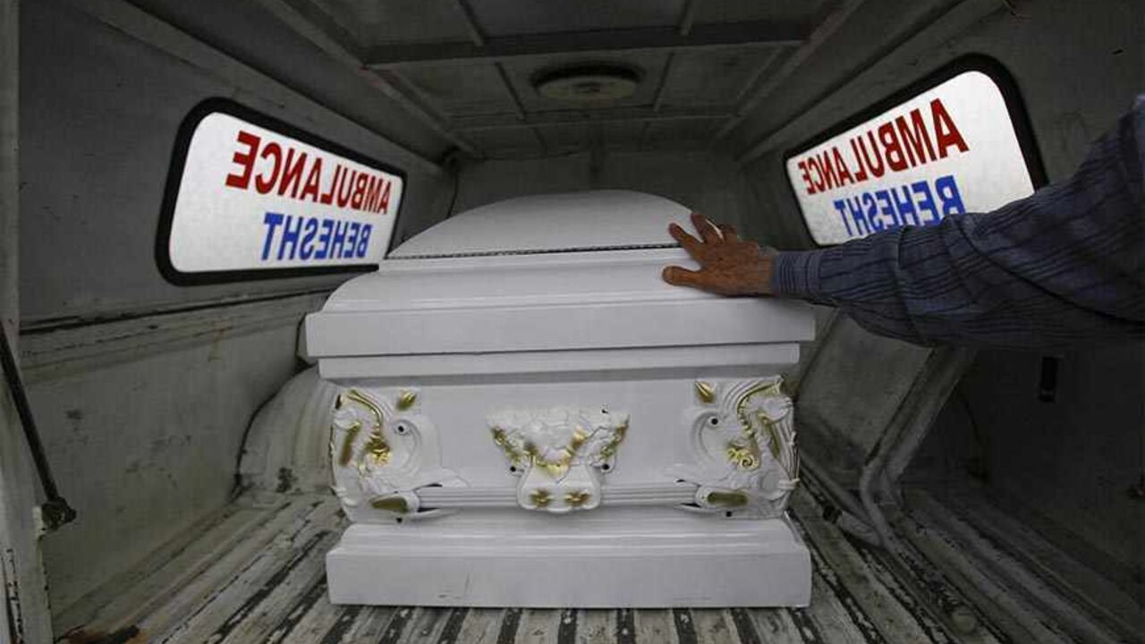 IRAN/ EDITORS' NOTE: Reuters and other foreign media are subject to Iranian restrictions on leaving the office to report, film or take pictures in Tehran.
A relative of a victim of an accident prays as he puts his hand on a coffin outside the Imam Khomeini International Airport in south of Tehran June 20, 2010. Some Iranian medical students and doctors killed in an accident after their bus plummeted into a ravine in Balamban town in Philippines. REUTERS/ISNA/Hemmat Khahi (IRAN - Tags: DISASTER POLITICS IMAGES O
