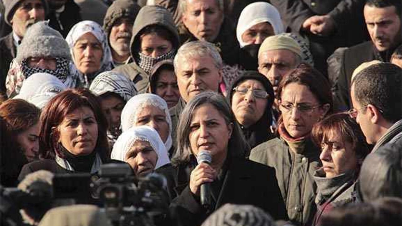 FRANCE-KURDS/ Gultan Kisanak (C), co-leader of Turkey's pro-Kurdish opposition Peace and Democracy Party (BDP), makes a speech on the killing of three female Kurdish activist during a demonstration in Diyarbakir, southeastern Turkey, January 10, 2013. Three female Kurdish activists including a founding member of the PKK rebel group were shot dead in Paris overnight in execution-style killings condemned by Turkish politicians trying to broker a peace deal. REUTERS/Sertac Kayar (TURKEY - Tags: POLITICS CIVIL UNREST) - RTR3