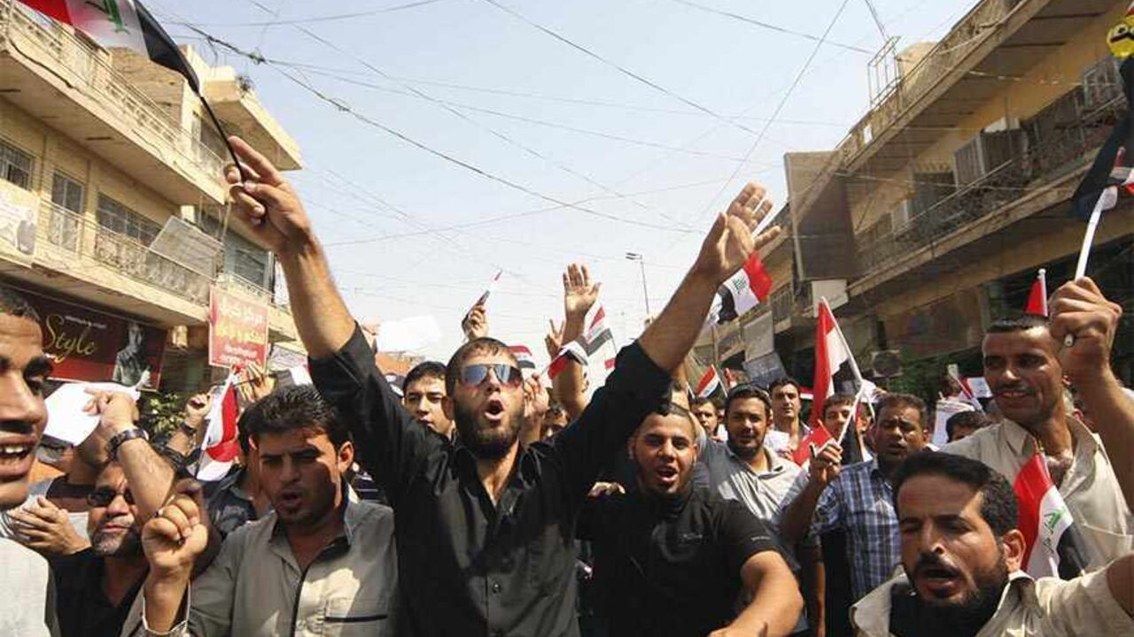 IRAQ-PROTEST/ Protesters demand that the pensions of parliamentarians be cancelled during a demonstration in Kerbala, 110 km (68 miles) south of Baghdad, August 31, 2013. Hundreds of protesters took to the streets in Baghdad and central and southern Iraq on Saturday against generous pension payments to lawmakers in a county where many are still struggling to get jobs and basic services. REUTERS/Mushtaq Muhammed (IRAQ - Tags - Tags: POLITICS BUSINESS EMPLOYMENT SOCIETY CIVIL UNREST) - RTX132K4