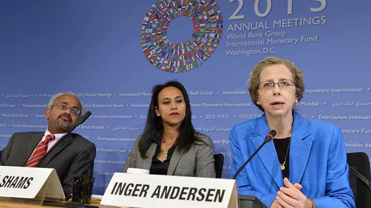 USA/ IMF-FISCAL Inger Andersen, (R), the World Bank's Vice President for the Middle East and North Africa (MENA) region, makes remarks as Shanta Devarajan, (L), the World Bank's chief economist for MENA and communications manager Heba Shams listen, as she discusses political turmoil and economics in the region at a news conference during the IMF and World Bank's 2013 Annual Fall Meetings, in Washington, October 10, 2013. The meetings come at a time of economic uncertainty with the world's nations possibly slipping back int