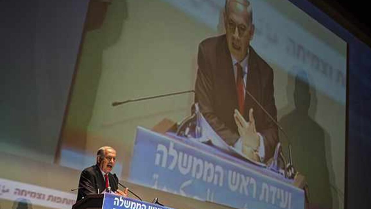 PALESTINIANS-ISRAEL/POLITICS Israel's Prime Minister Benjamin Netanyahu speaks at a conference in Tel Aviv University October 29, 2013. A planned release of 26 Palestinian prisoners has provoked feuding within Israel's governing coalition, already under strain from U.S.-brokered peace talks. Jewish Home, led by Naftali Bennett, then tried to get a proposal to freeze further prisoner releases past a ministerial committee, where members Netanyahu's Likud party voted it down on Sunday. REUTERS/ Nir Elias (ISRAEL - Tags: POLITICS) - RTX