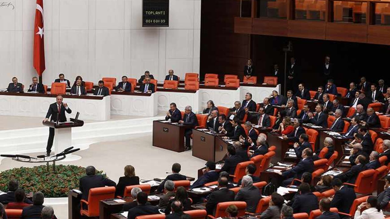 TURKEY-PARLIAMENT/HEADSCARF Turkey's main opposition Republican People's Party (CHP) lawmaker Muharrem Ince addresses the Turkish Parliament in Ankara October 31, 2013. Four female lawmakers from Turkey's Islamist-rooted ruling party wore their Islamic head scarves in parliament on Thursday in a challenge to the country's secular tradition. Four female lawmakers, Nurcan Dalbudak, Sevde Beyazit Kacar, Gulay Samanci and Gonul Bekin Sahkulubey, from Turkey's Islamist-rooted ruling party AKP wore their Islamic head scarves in parliament o