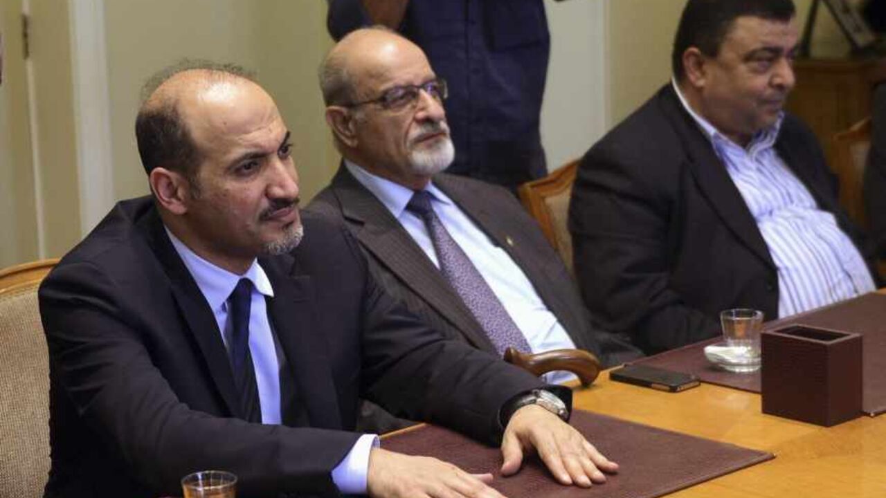 President of the Syrian National Coalition, Ahmad Al-Jarba, looks on during a meeting with Arab League Secretary General Nabil al-Arabi in Cairo President of the Syrian National Coalition, Ahmad Al-Jarba (L), looks on during a meeting with Arab League Secretary General Nabil al-Arabi (not pictured) in Cairo, November 2, 2013. Arab League Foreign Ministers will meet in Cairo in an emergency session to discuss the ongoing crisis in Syria on Sunday. REUTERS/Stringer (EGYPT - Tags: POLITICS) - RTX14XDS