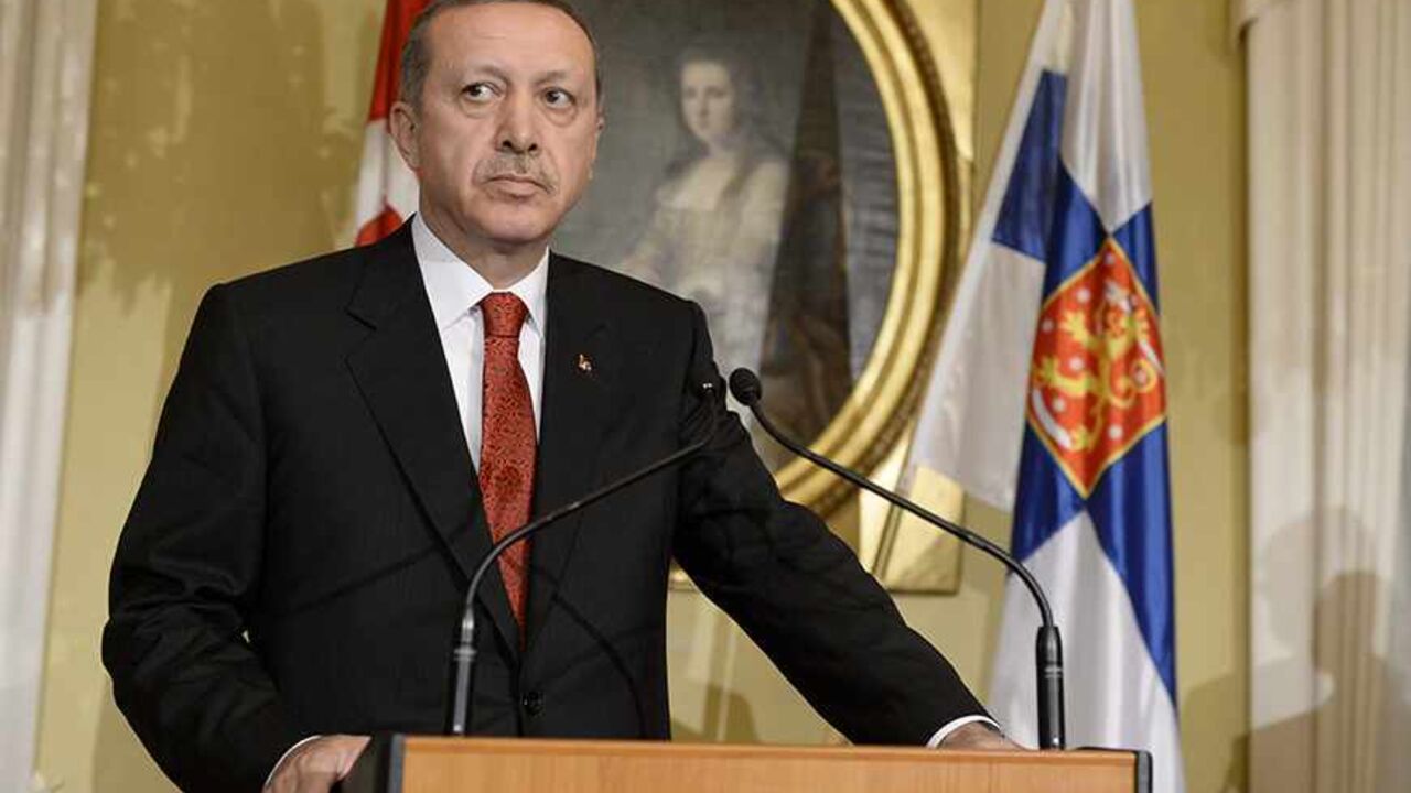 FINLAND-TURKEY/ Turkey's Prime Minister Tayyip Erdogan addresses reporters during a news conference at the Government Banquet Hall in Helsinki, November 6, 2013. REUTERS/Jussi Nukari/Lehtikuva (FINLAND - Tags: POLITICS) ATTENTION EDITORS - THIS IMAGE HAS BEEN SUPPLIED BY A THIRD PARTY. IT IS DISTRIBUTED, EXACTLY AS RECEIVED BY REUTERS, AS A SERVICE TO CLIENTS. NO THIRD PARTY SALES. NOT FOR USE BY REUTERS THIRD PARTY DISTRIBUTORS. FINLAND OUT. NO COMMERCIAL OR EDITORIAL SALES IN FINLAND - RTX152EZ