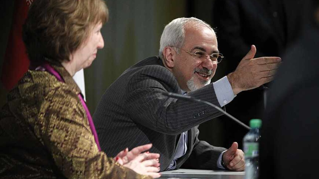 Iranian Foreign Minister Mohammad Javad Zarif (R) speaks next to European Union foreign policy chief Catherine Ashton during a news conference at the end of the Iranian nuclear talks in Geneva November 10, 2013. Zarif and Ashton said on Sunday they hoped Iran and six world powers would reach an agreement when they gather again in 10 days, adding that the latest round of talks on Tehran's nuclear programme was something all delegations can build on.REUTERS/Jason Reed   (SWITZERLAND - Tags: POLITICS) - RTX157