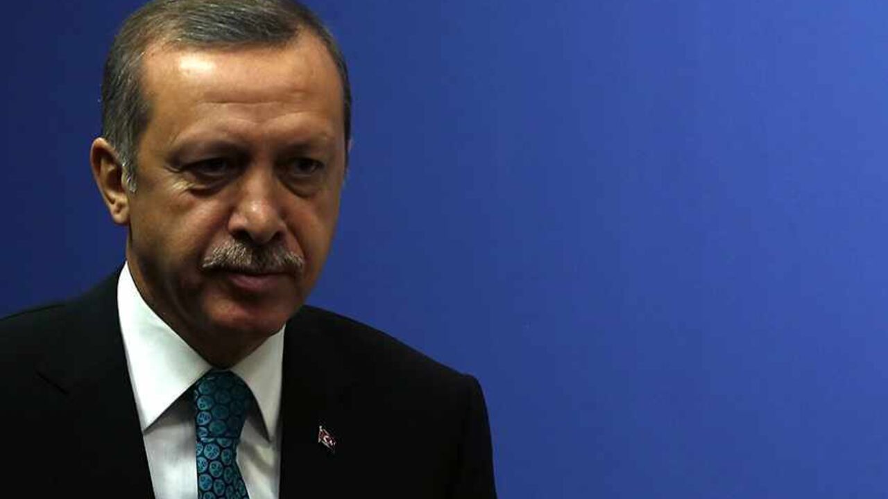 TURKEY-AZERBAIJAN/ Turkey's Prime Minister Tayyip Erdogan addresses the media in Ankara November 13, 2013. Erdogan said on Wednesday work on the Trans-Anatolian natural gas pipeline project (TANAP), which will carry Azeri natural gas, will begin in early 2014. Turkey, which has a 20 percent stake in TANAP, and Azerbaijan, which controls 80 percent, are looking at ways to cooperate on shipping Azeri gas to the Balkans, Erdogan also said after talks with Azeri President Ilham Aliyev in Ankara. REUTERS/Umit Bektas (TURKEY - Tags