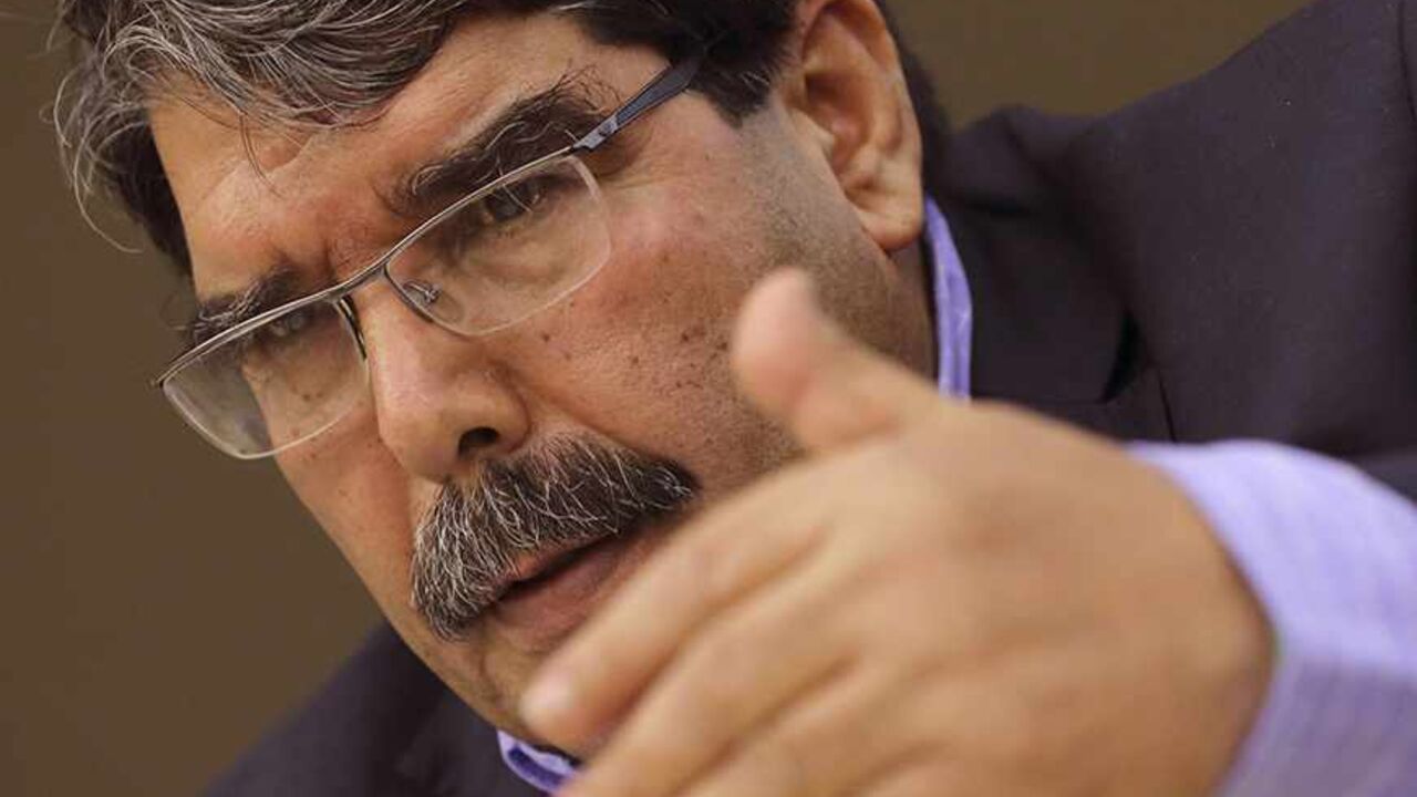 SYRIA-KURD/ Kurdish Democratic Union Party (PYD) head Saleh Muslim speaks during a conference in Paris November 13, 2013. Islamist groups in northern Syria are weakening after months of fighting and Kurdish militias are gaining ground, top Kurdish leader Muslim said on Wednesday, vowing to continue their advances. To match SYRIA-KURDS/ REUTERS/Philippe Wojazer (FRANCE - Tags: POLITICS CONFLICT) - RTX15C6C