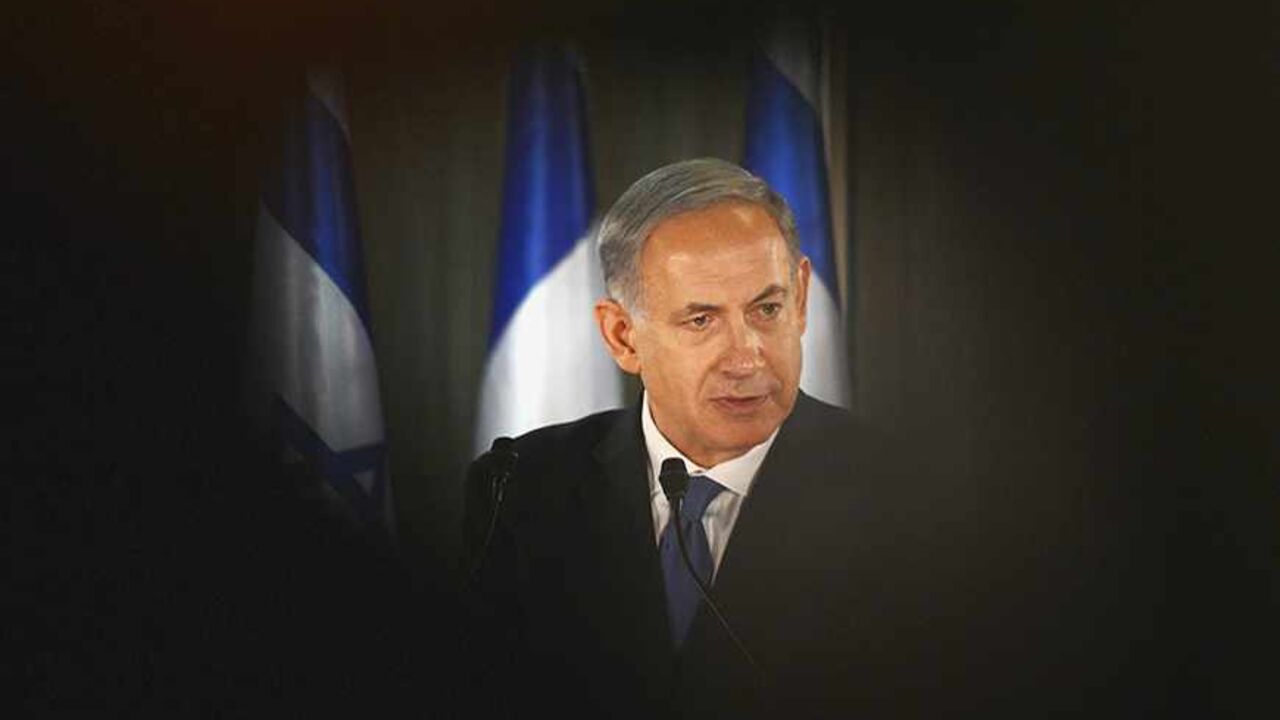 ISRAEL/ Israel Prime Minister Benjamin Netanyahu speaks during a joint news conference with French President Francois Hollande (not pictured) at his residence in Jerusalem November 17, 2013. President Hollande assured Israel on Sunday that France would continue to oppose an easing of economic sanctions against Iran until it was convinced Tehran had ended a pursuit of nuclear weapons. REUTERS/Alain Jocard/Pool (JERUSALEM - Tags: POLITICS) - RTX15HKI