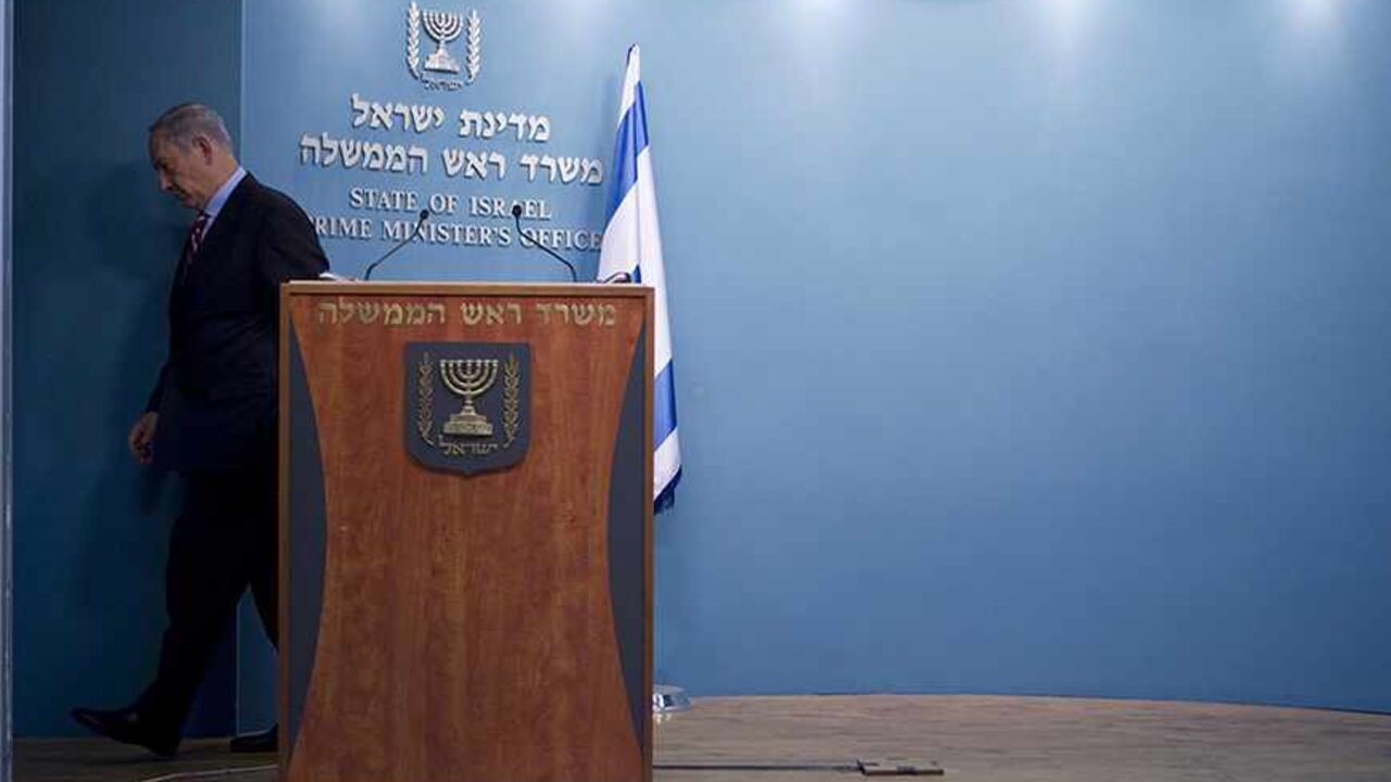 IRAN-NUCLEAR/ISRAEL Israel's Prime Minister Benjamin Netanyahu leaves after delivering a statement at his office in Jerusalem November 24, 2013. Netanyahu on Sunday denounced the world powers' nuclear agreement with Iran as a historic mistake that left the production of atomic weapons within Tehran's reach. REUTERS/Baz Ratner (JERUSALEM - Tags: POLITICS) - RTX15R0J