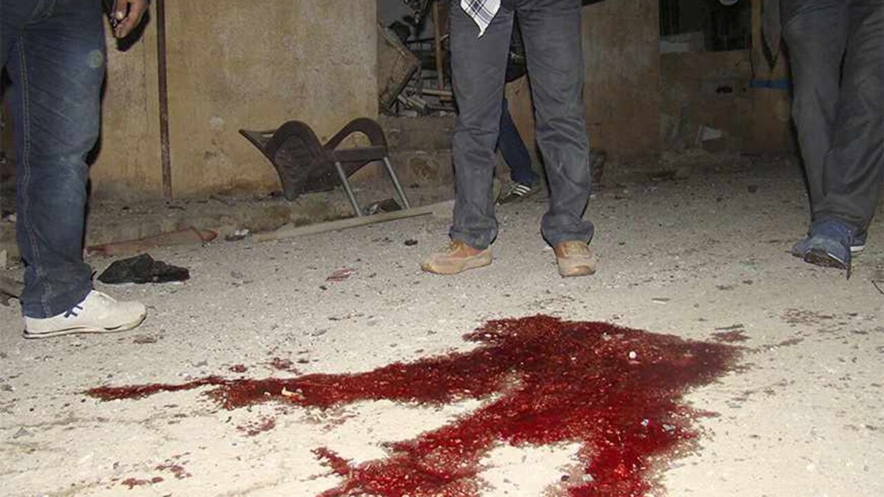 Blood stains are seen on the ground after a suicide bombing at the Kurdish Internal Security Forces Center (Asayish) at the Suez Canal neighbourhood in Qamishli November 23, 2013. The al-Qaeda linked Islamic State of Iraq and the Levant have claimed responsibility for the bombing which killed three people, including two members of the Asayish police force, and nine others wounded, activists said. Picture taken November 23, 2013. REUTERS/Massoud Mohammed (SYRIA - Tags: POLITICS CIVIL UNREST CONFLICT) - RTX15