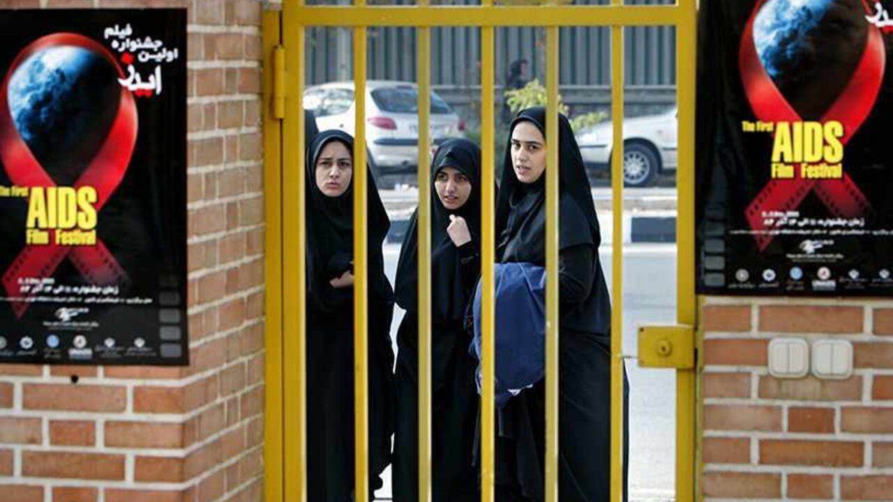 TEH03D Young Iranian women attend a ceremony to mark World HIV/AIDS Day at a cultural centre in Tehran December 1, 2005. On World AIDS Day, ways of having "healthy and safe sexual life" were explained to Iranians, who live in a country where having illicit sexual relationships is a crime. REUTERS/Morteza Nikoubazl
