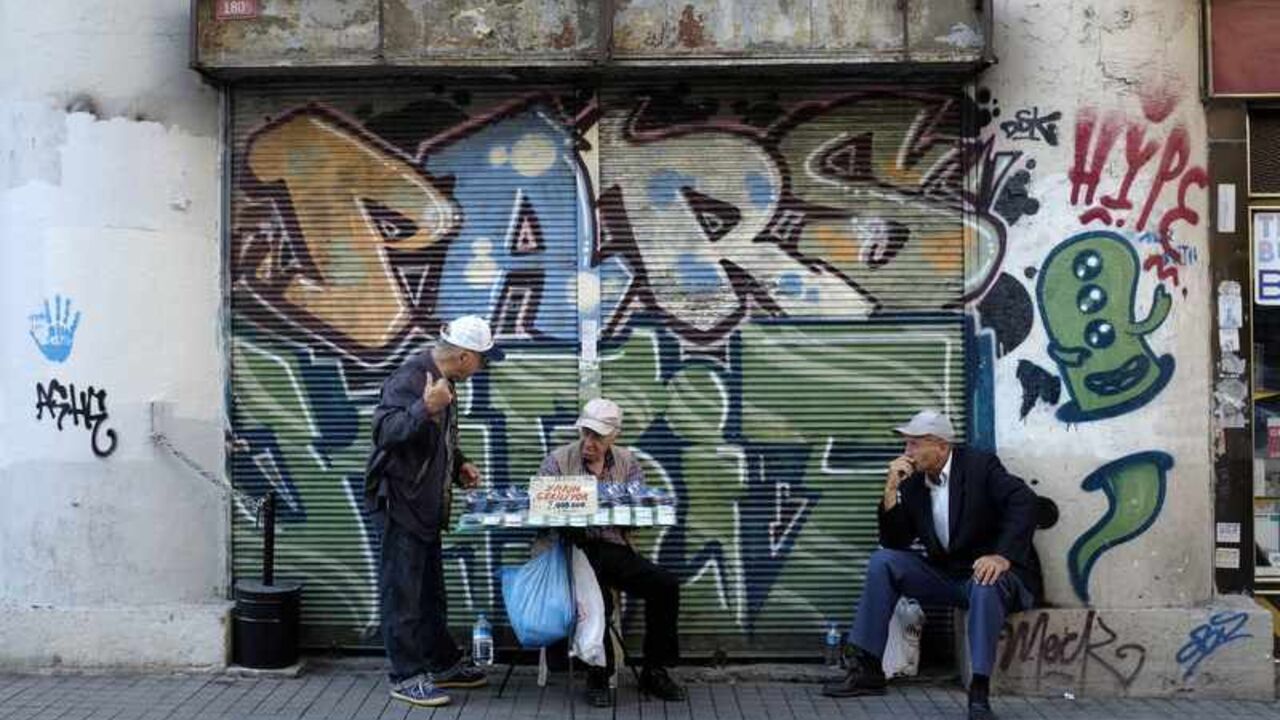 National lottery sellers chat on main shopping and pedestrian street of Istiklal in central Istanbul National lottery sellers (L and C) chat on the main shopping and pedestrian street of Istiklal in central Istanbul September 27, 2013. REUTERS/Murad Sezer (TURKEY - Tags: SOCIETY) - RTX1428N
