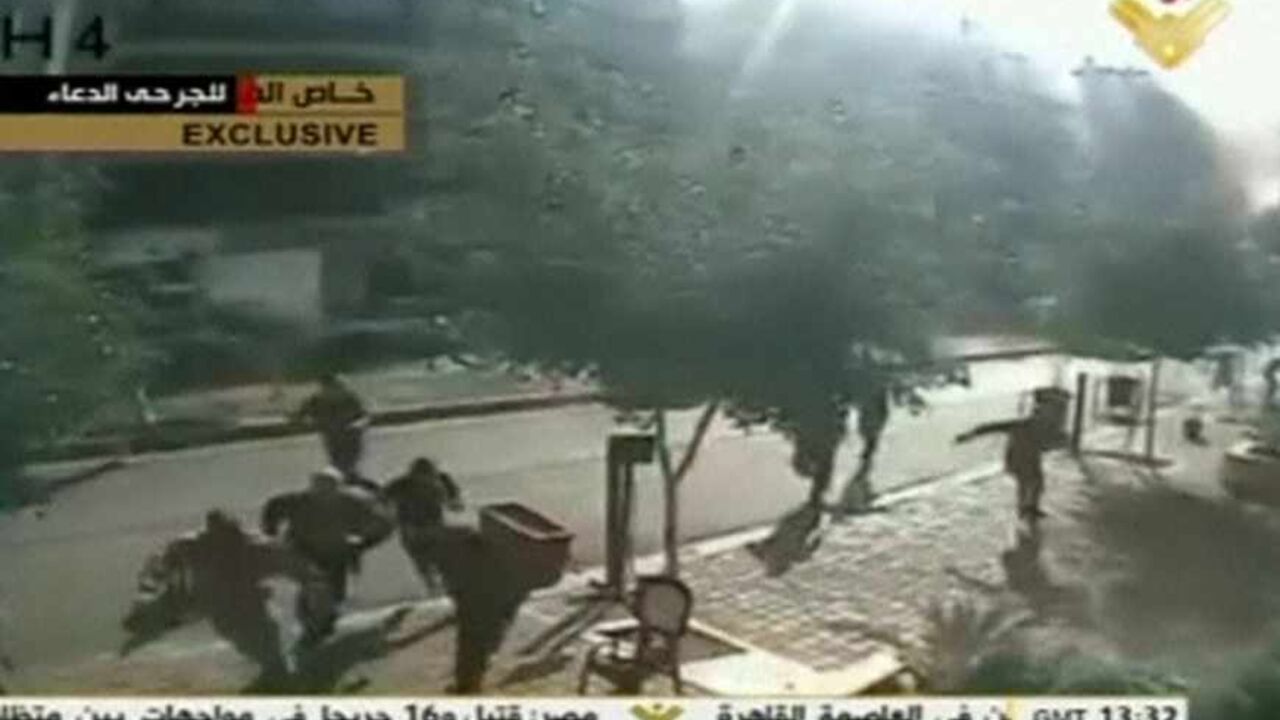 People run after the second blast rocked the Iranian embassy compound in Beirut People run after the second blast rocked the Iranian embassy compound in Beirut in this still image taken from a security camera near the embassy, November 19, 2013. Two suicide bombings rocked Iran's embassy compound in Lebanon on November 19, killing at least 23 people including an Iranian cultural attache and hurling bodies and burning wreckage across a debris-strewn street, with at least 146 wounded. Image taken November 19, 2013. REUTERS/Al Manar via Reuters TV (LEBANON - Tags: POLITICS CIVIL UN
