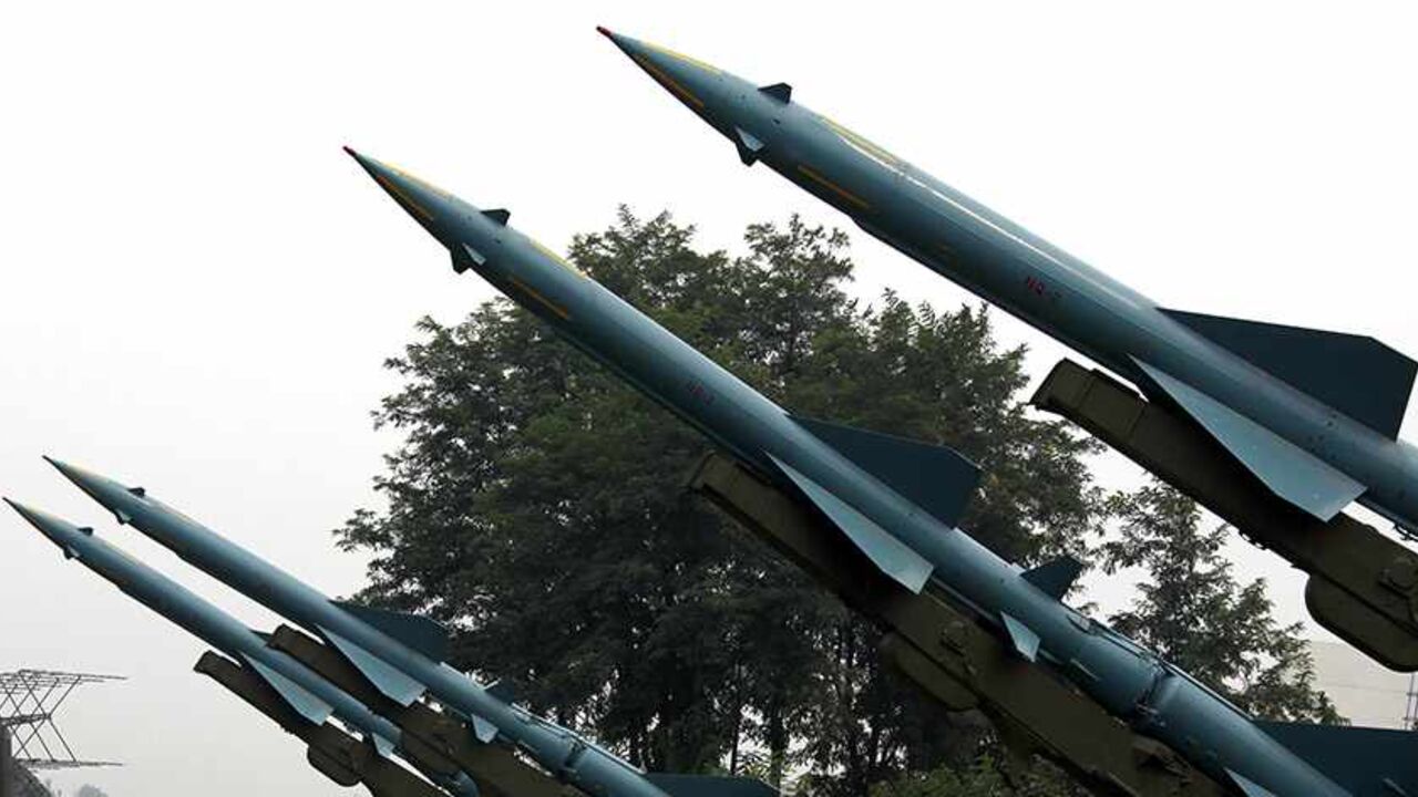 CHINA-USA/MILITARY Visitors to the China Aviation Museum located on the outskirts of Beijing walk under old missiles on display August 17, 2010. China is expanding its military edge over Taiwan, increasing the lethality of its short-range ballistic missiles while raising the risk of "misunderstanding and miscalculation," the Pentagon said on Monday, just a day after a leading armed forces newspaper said that China's military thinking is outmoded and they should learn from others, especially the United States, when it comes to