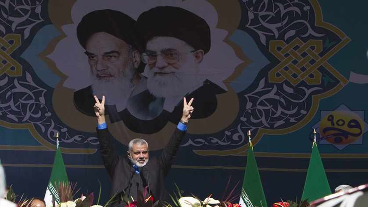 IRAN-NUCLEAR/AHMADINEJAD EDITORS' NOTE: Reuters and other foreign media are subject to Iranian restrictions on leaving the office to report, film or take pictures in Tehran.
Hamas Leader Ismail Haniyeh flashes the victory sign during a ceremony to mark the 33rd anniversary of the Islamic Revolution, in Tehran's Azadi square February 11, 2012. Iran's President Mahmoud Ahmadinejad said on the anniversary of the revolution that the Islamic Republic would soon announce "very important" REUTERS/Raheb Homavandi (IRAN - Tags: ANNIVERSAR